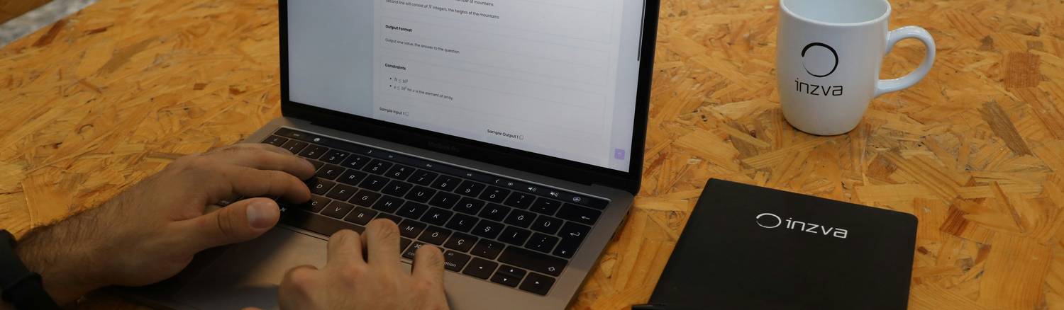 A user reviewing terms of service and privacy policy on a laptop with a pen and paper nearby, representing online agreement and website responsibility
