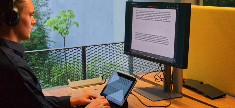 A person reviewing detailed text statistics on a screen for writing improvement